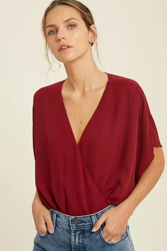 Bold, confident, and stylish women’s clothing   DOLLY DOLMAN SURPLICE BODYSUIT FINAL SALE